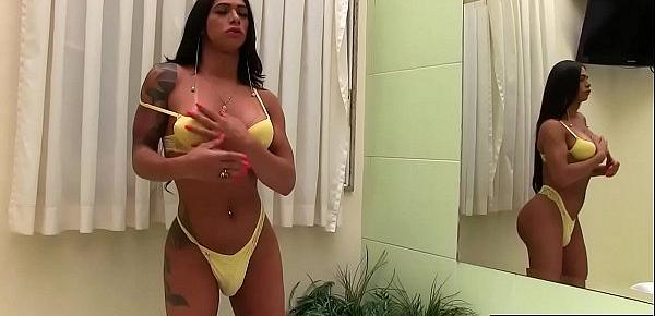  Shemale Rosy Pinheiro Jerks her dick while using a dildo